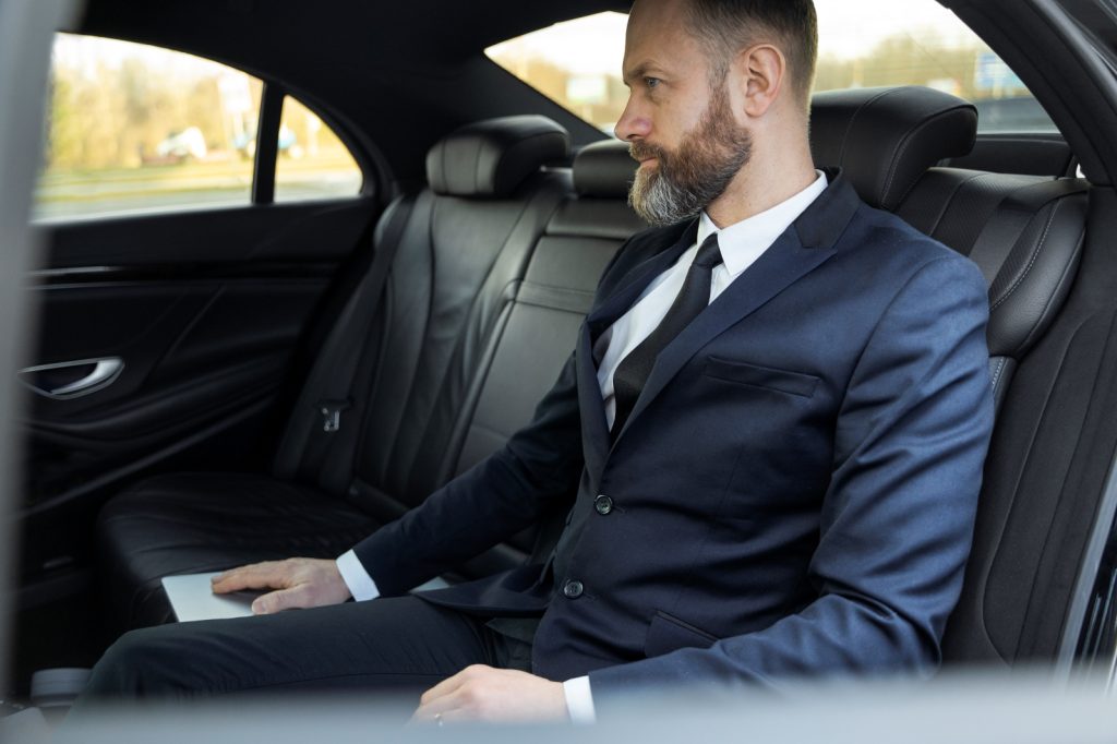 elegant uber driver giving taxi ride
